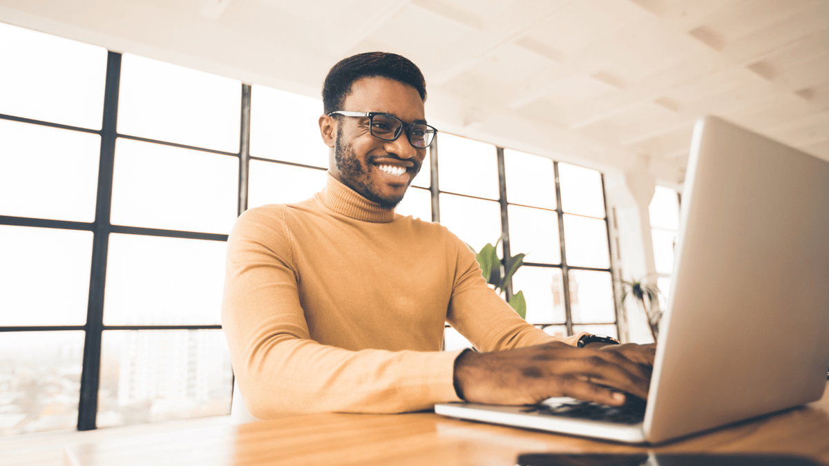 Man smiling whilst organising event
