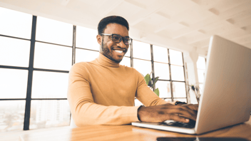 Man smiling whilst organising event