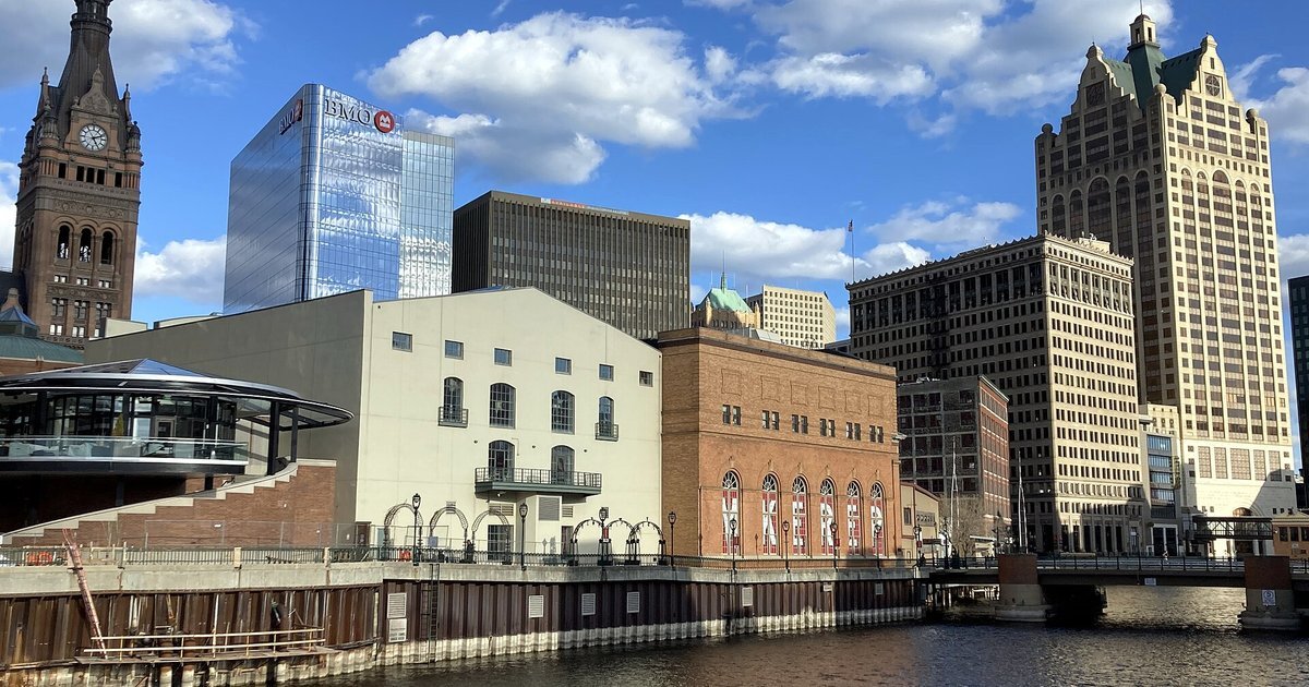 Downtown Milwaukee skyline and City Hall tower above the Milwaukee River