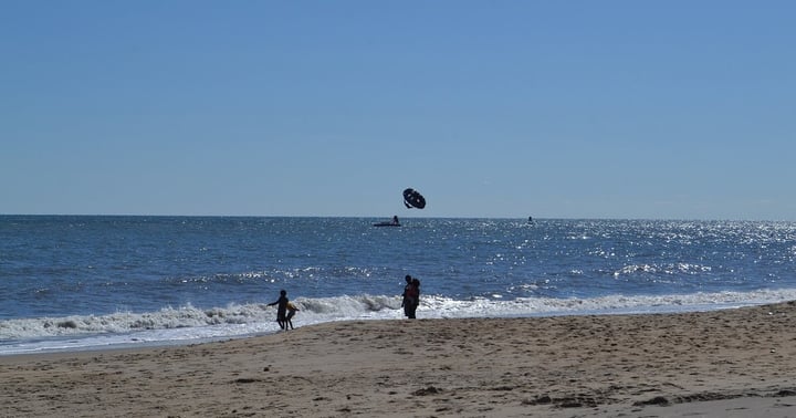 A parasail over the ocean at the Virginia Beach oceanfront