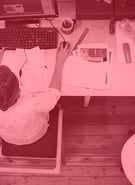 Man working at messy desk