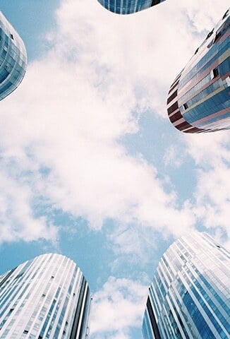tall buildings and blue sky with clouds