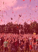 Crowd throwing juggling objects in air