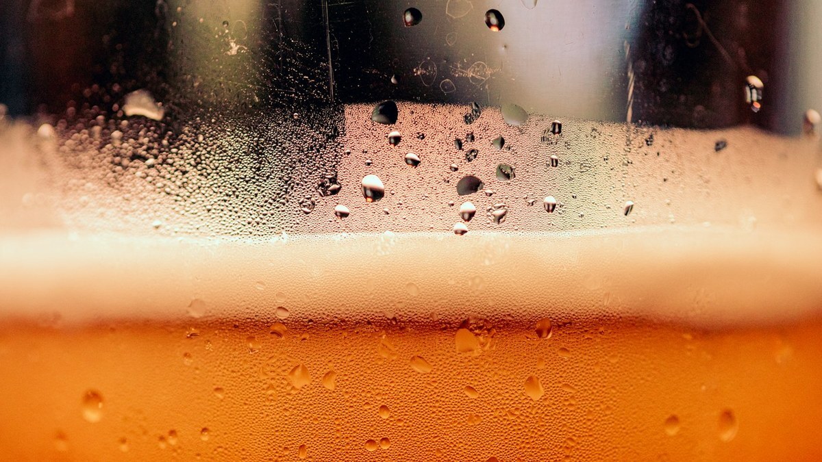 Glasses of golden cider and apples celebrating harvest season