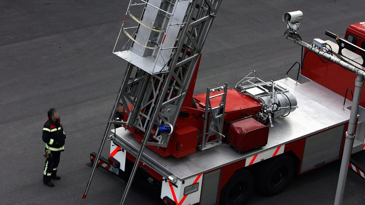 Firefighters training with a ladder truck