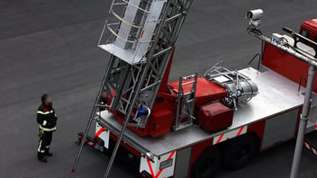 Firefighters training with a ladder truck