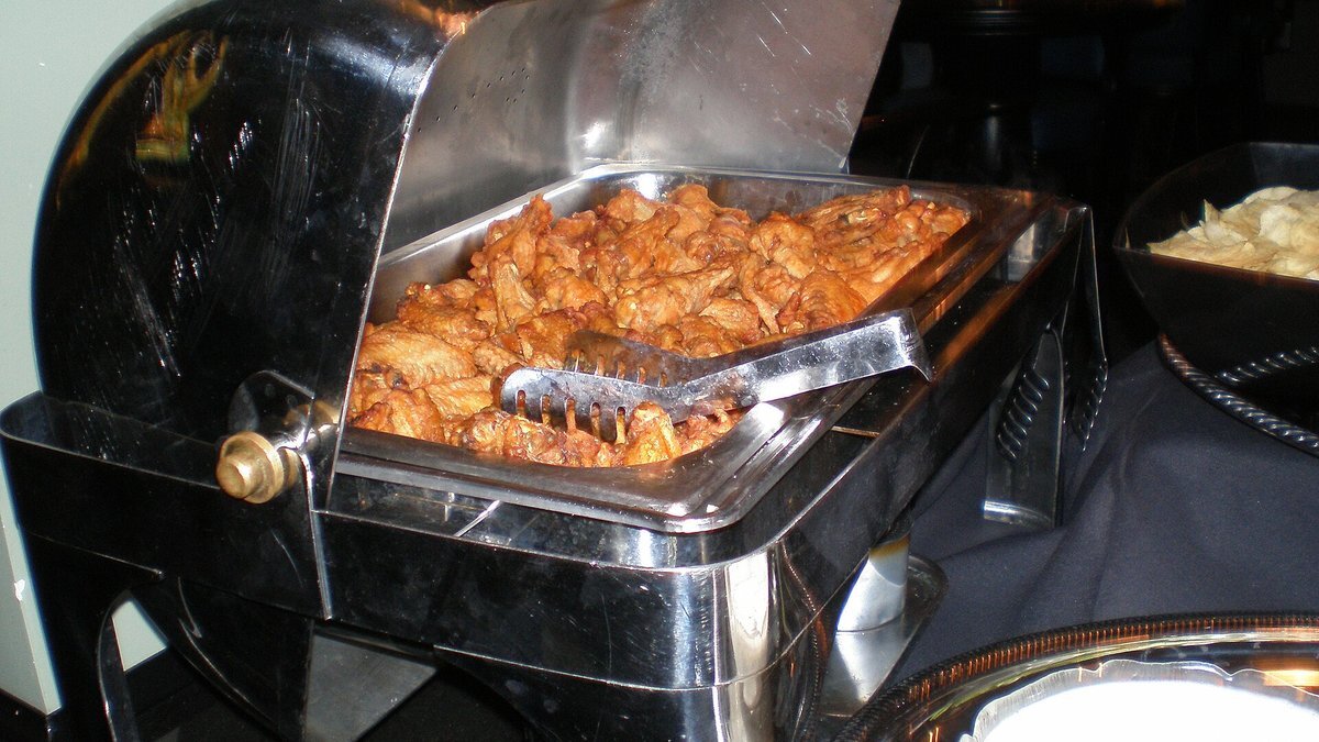 A tray of chicken wings at a food stand