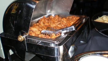 A tray of chicken wings at a food stand
