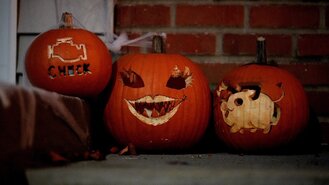 Carved jack-o-lanterns on a porch